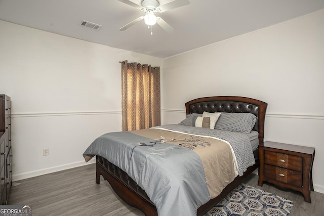 bedroom featuring dark hardwood / wood-style floors and ceiling fan