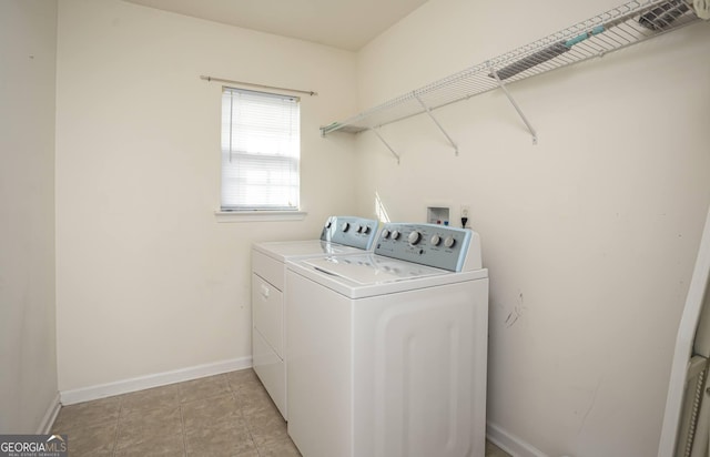 clothes washing area with washing machine and clothes dryer