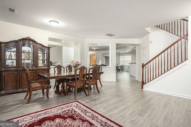 dining space featuring light wood-type flooring