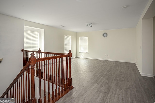 spare room with hardwood / wood-style floors