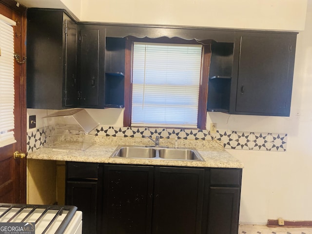 kitchen featuring decorative backsplash, sink, and plenty of natural light