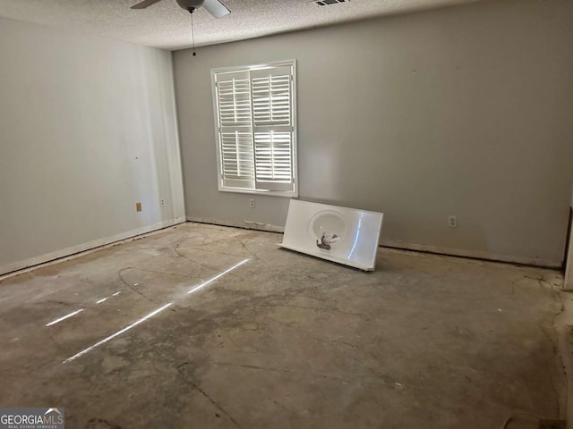 unfurnished room featuring a textured ceiling and ceiling fan