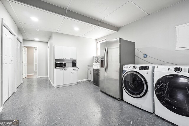 washroom with washer and dryer