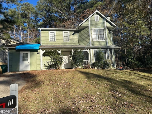 view of property featuring a front yard