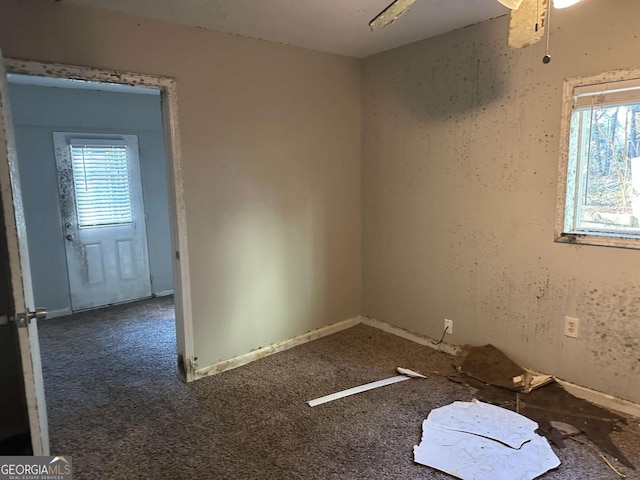 carpeted empty room with ceiling fan