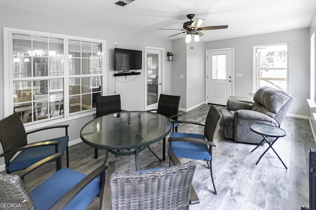 living room featuring ceiling fan and hardwood / wood-style floors