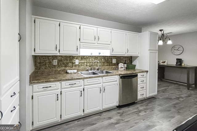 kitchen with sink, light hardwood / wood-style flooring, stainless steel dishwasher, decorative backsplash, and white cabinets