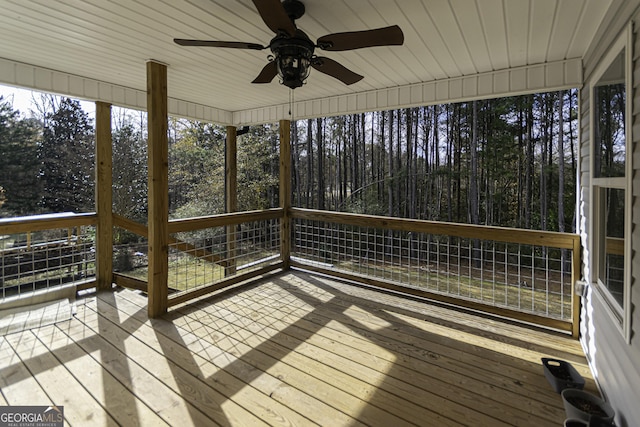 wooden terrace featuring ceiling fan