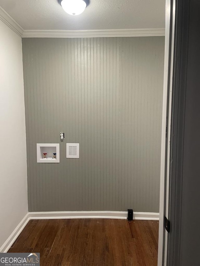 laundry room with washer hookup, wood-type flooring, and crown molding