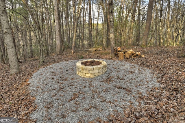 view of yard featuring an outdoor fire pit