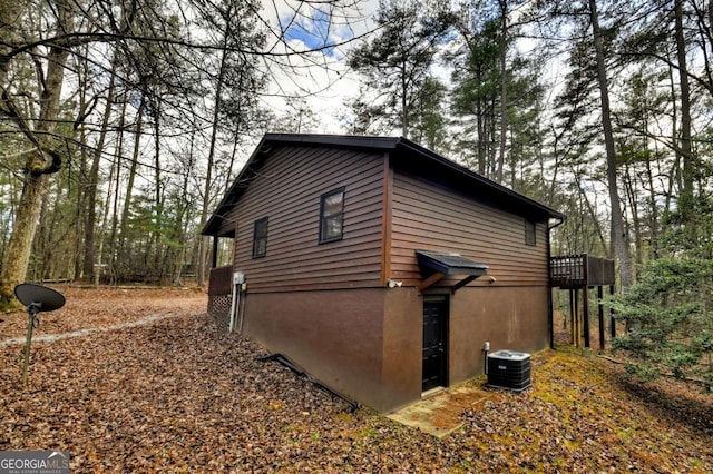 view of side of property featuring central air condition unit