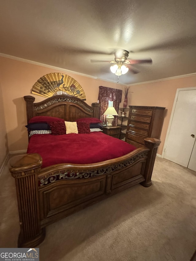 carpeted bedroom featuring ceiling fan and ornamental molding