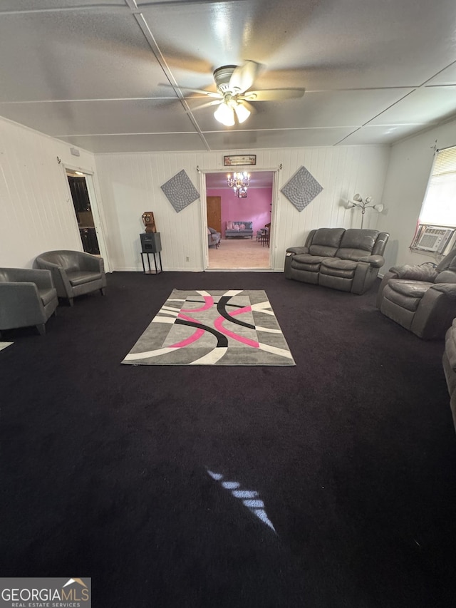 playroom featuring cooling unit, ceiling fan, carpet floors, and wood walls