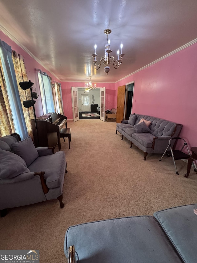 carpeted living room featuring crown molding, french doors, and a notable chandelier