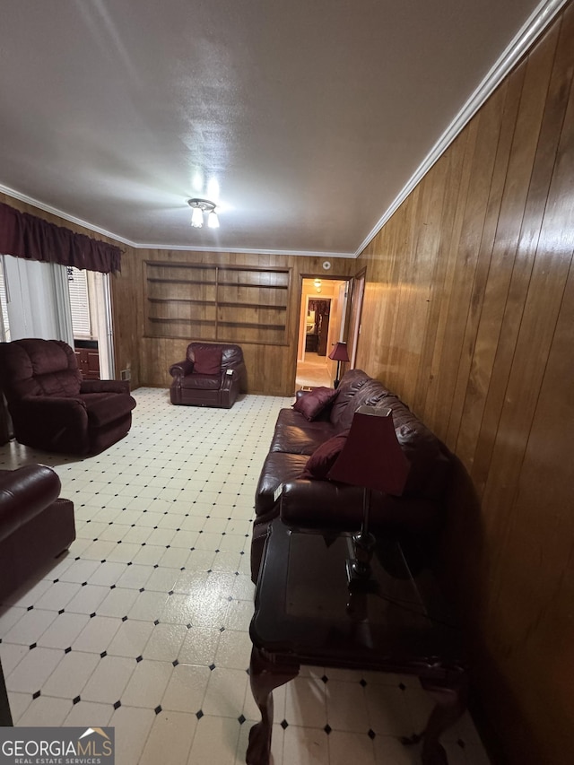 living room featuring ornamental molding and wooden walls