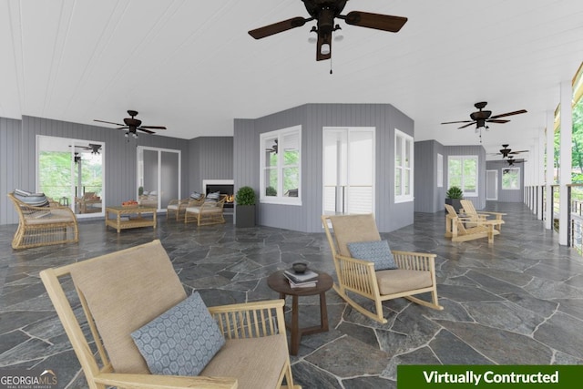 view of patio featuring a ceiling fan and french doors