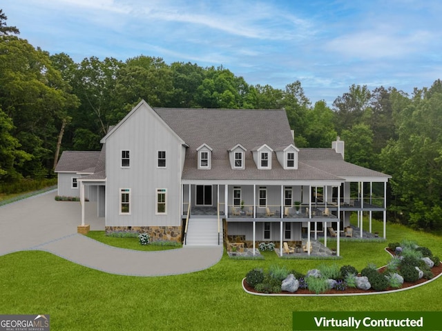 view of front of home with a front lawn, a patio, and a deck