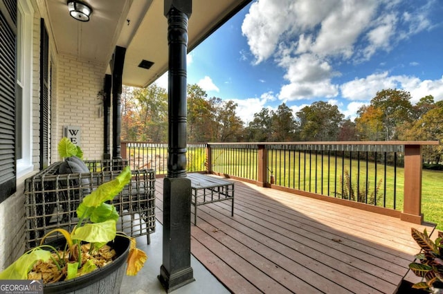 deck featuring a lawn