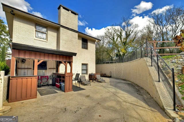 rear view of property with a patio