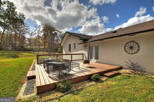 wooden deck featuring french doors and a yard