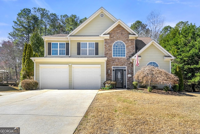 view of front of house featuring driveway, stone siding, an attached garage, and a front lawn