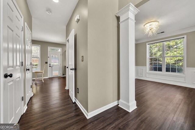 kitchen featuring kitchen peninsula, white cabinetry, dark hardwood / wood-style floors, and appliances with stainless steel finishes