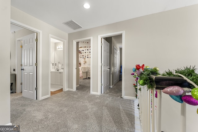 hallway with carpet flooring