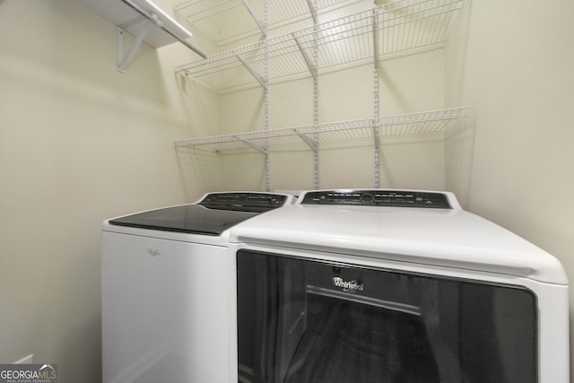 washroom featuring laundry area and washer and clothes dryer