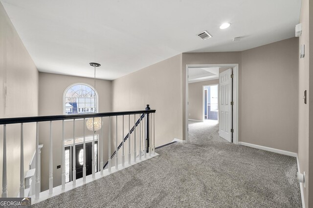 rear view of property with a sunroom, a patio area, and exterior bar