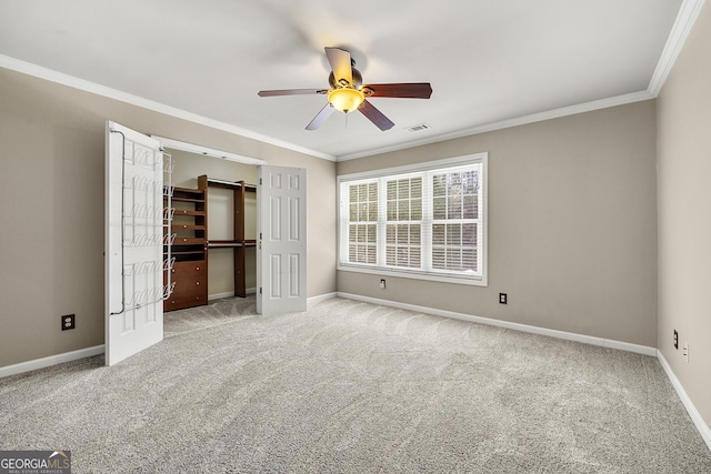 unfurnished bedroom featuring baseboards, light carpet, visible vents, and crown molding