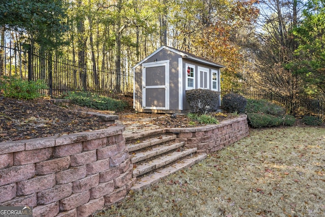 view of shed with a fenced backyard