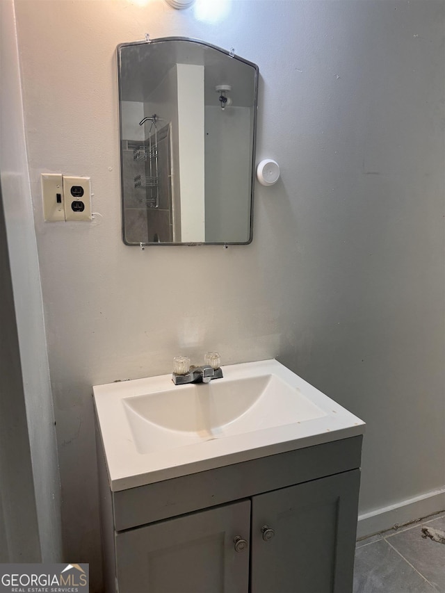 bathroom with tile patterned floors and vanity