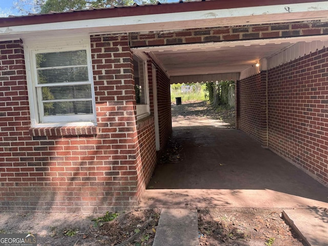 view of vehicle parking featuring a carport