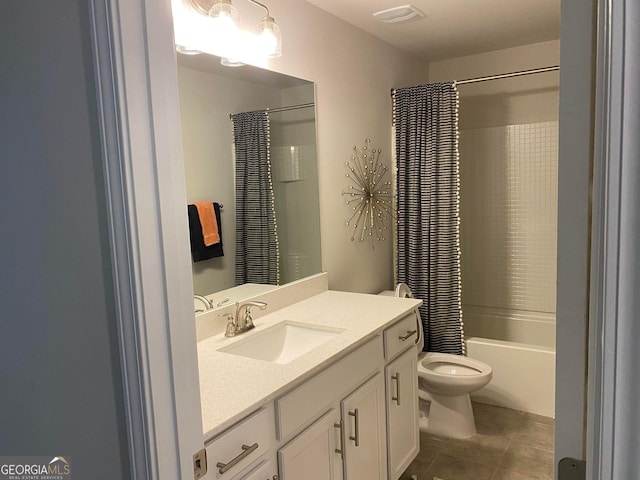 full bathroom featuring tile patterned flooring, shower / bath combo with shower curtain, vanity, and toilet