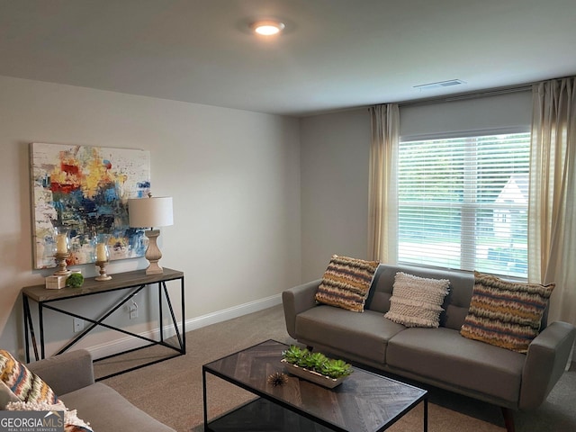 carpeted living room featuring a healthy amount of sunlight