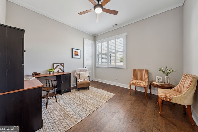 office with visible vents, a ceiling fan, baseboards, and wood finished floors