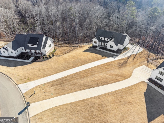 bird's eye view featuring a wooded view