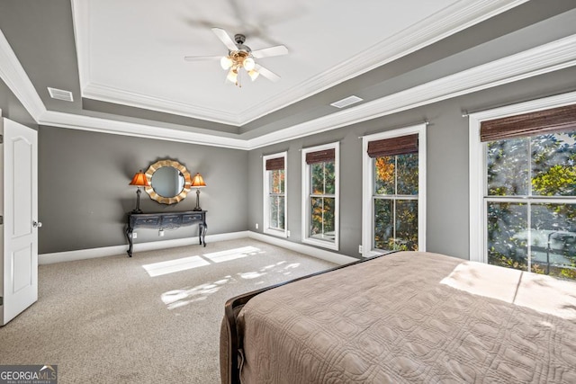 unfurnished bedroom featuring multiple windows, ceiling fan, crown molding, and light carpet