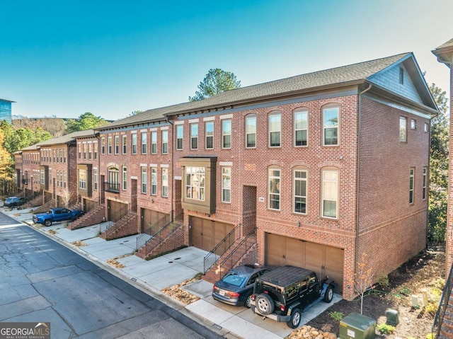 townhome / multi-family property featuring a garage