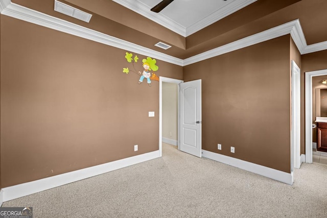 carpeted empty room with crown molding