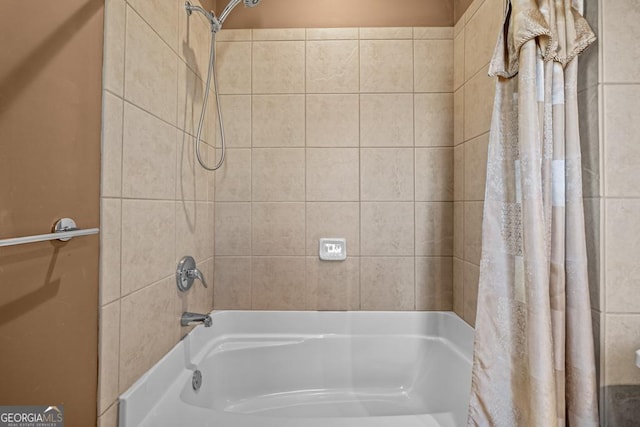 bathroom with shower / bathtub combination with curtain