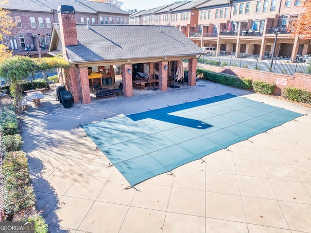 view of swimming pool with a patio area