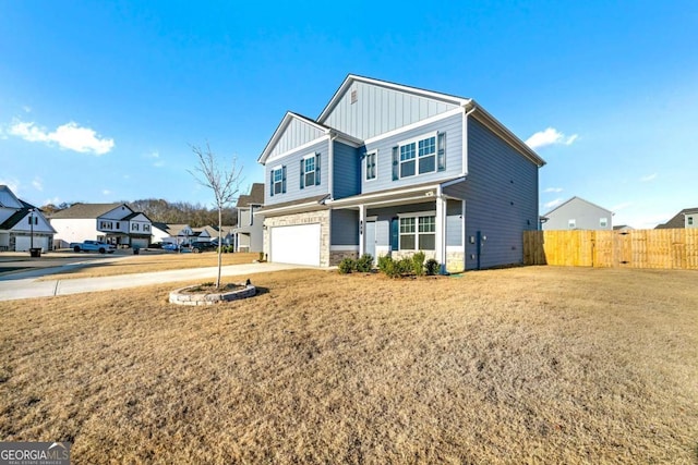 view of front of home with a front lawn and a garage