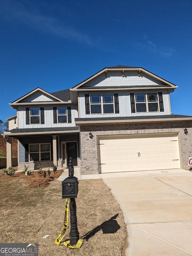 view of front of house with covered porch and a garage