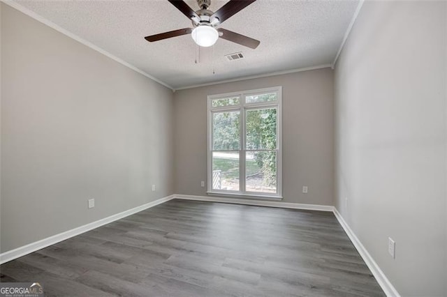 unfurnished room featuring ceiling fan, dark hardwood / wood-style flooring, ornamental molding, and a textured ceiling