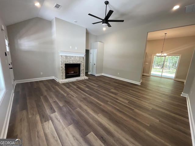 unfurnished living room featuring visible vents, ceiling fan with notable chandelier, baseboards, and lofted ceiling