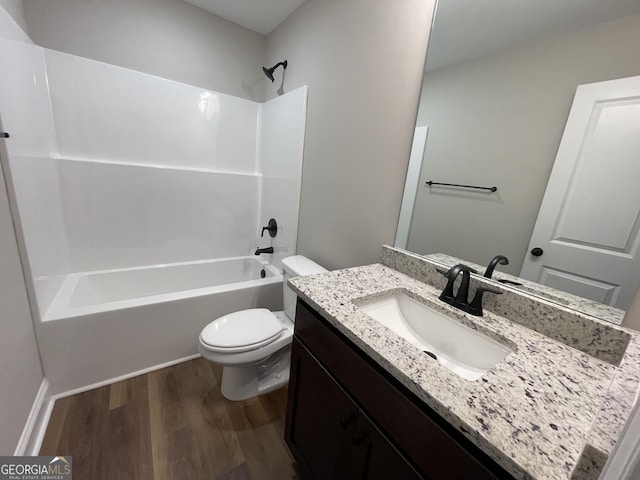 full bathroom with shower / bath combination, vanity, toilet, and wood finished floors