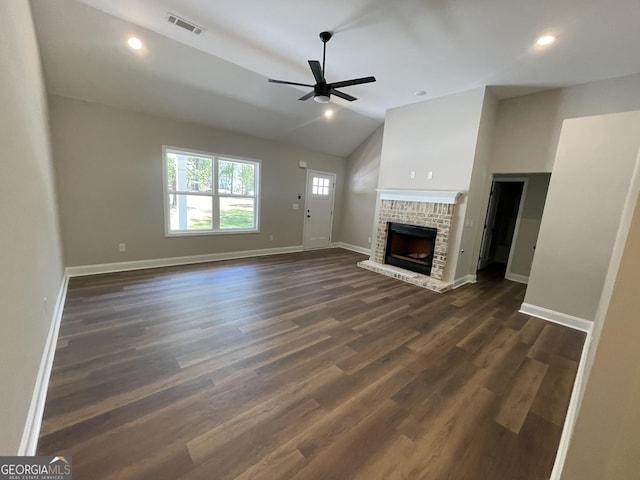 unfurnished living room with a fireplace, baseboards, vaulted ceiling, and a ceiling fan