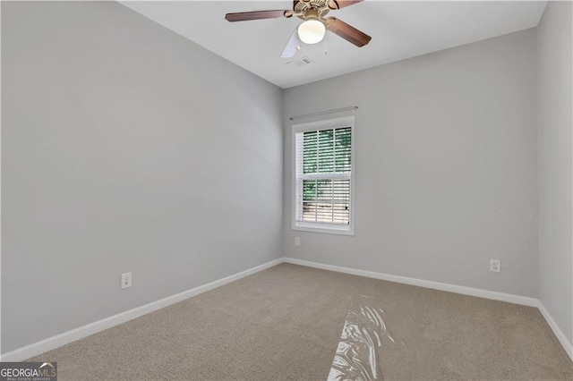 carpeted empty room with ceiling fan