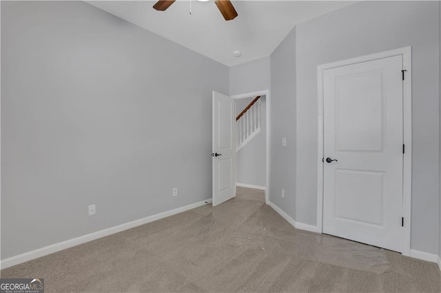 interior space featuring ceiling fan